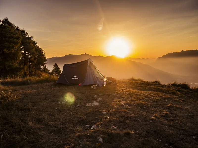 Camping stove and water purification system setup near a backcountry stream
